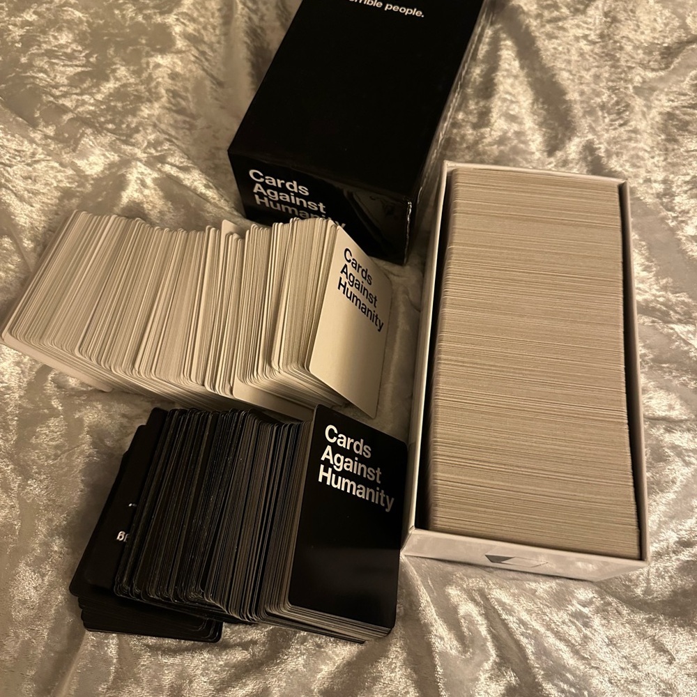 Cards Against Humanity Game Set Plus Lots of Expansion Packs